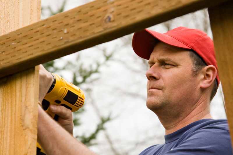 Contractor Working on Fence Post Removal